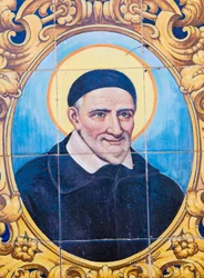 św. Wincentego a Paulo 1581-1660. Francuski ksiądz katolicki i św. Płytka ceramiczna na ulicę im. de Paula, Cordoba, prowincja Cordoba, Hiszpania.